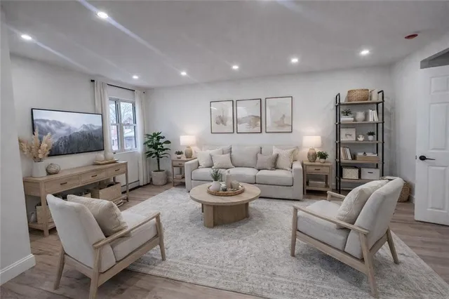 a spacious bedroom with a bed and a large mirror