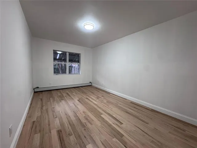 a kitchen with granite countertop stainless steel appliances and white cabinets