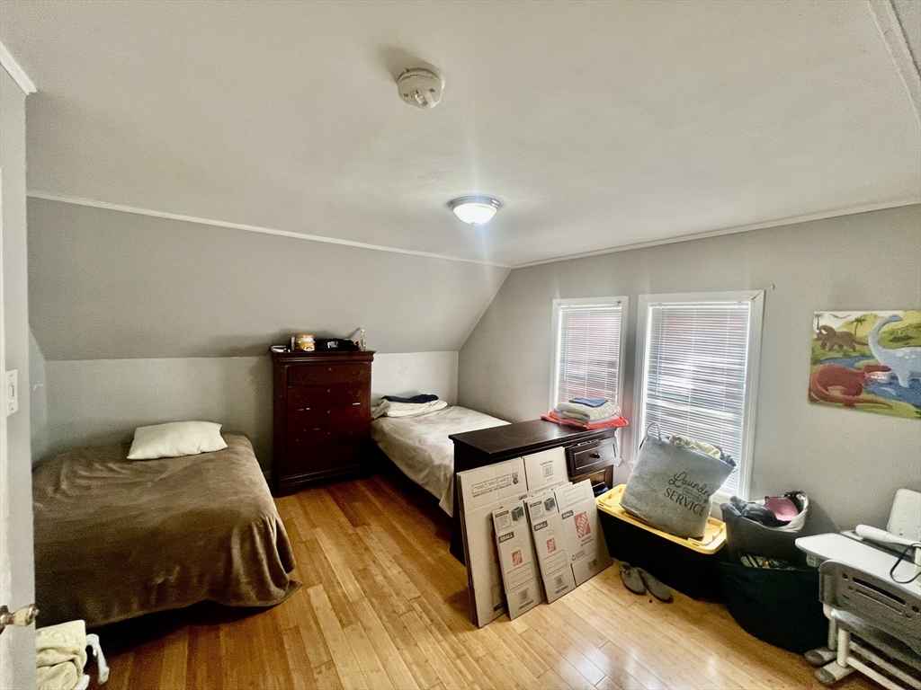 41 Pearl Street, Unit 2 Everett, MA 02149 - Photo 12 of 26 a bedroom with a bed and a window