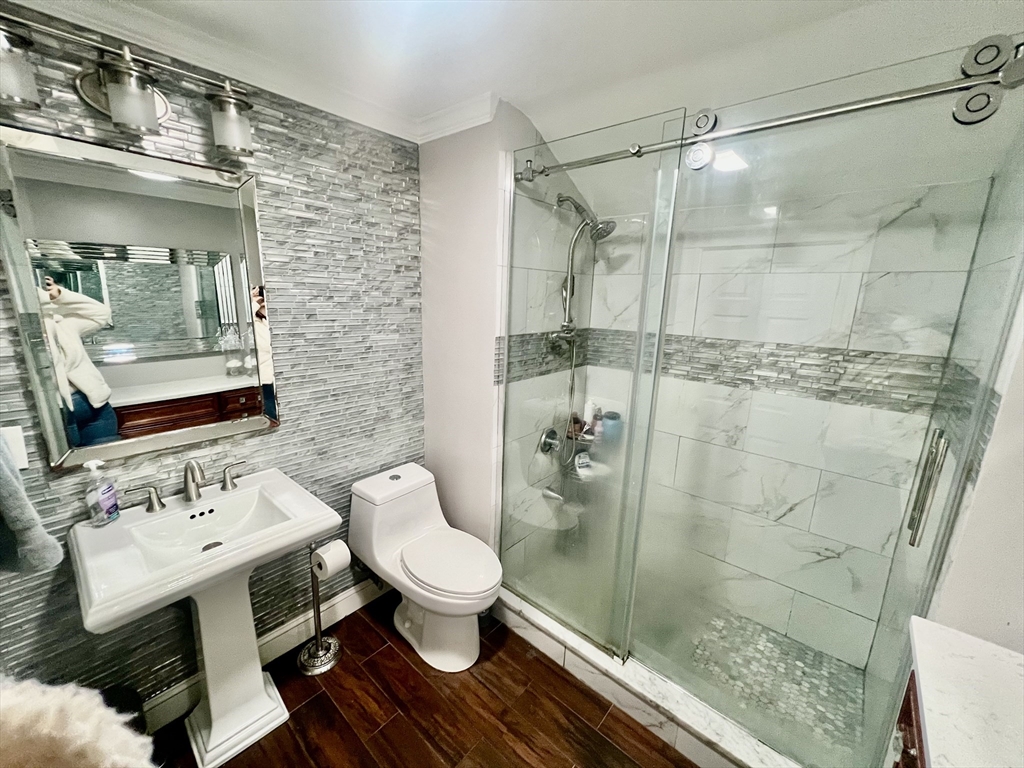 41 Pearl Street, Unit 2 Everett, MA 02149 - Photo 16 of 26 a bathroom with a sink toilet and shower