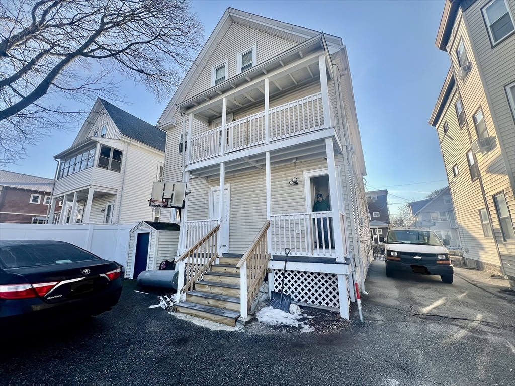 41 Pearl Street, Unit 2 Everett, MA 02149 - Photo 25 of 26 a view of a car park in front of house