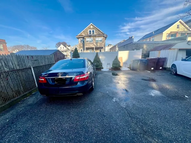 a car parked in a room next to a house