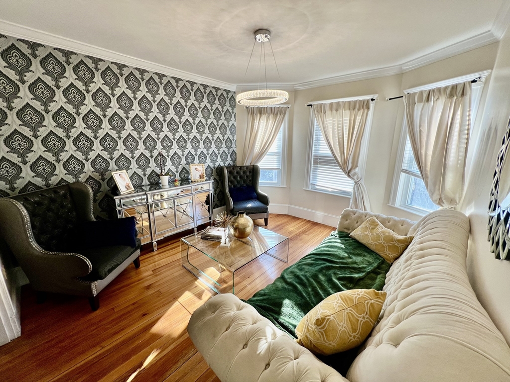 41 Pearl Street, Unit 2 Everett, MA 02149 - Photo 5 of 26 a living room with furniture and a wooden floor