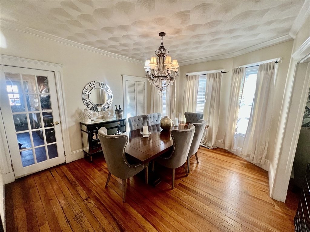 41 Pearl Street, Unit 2 Everett, MA 02149 - Photo 8 of 26 a view of a dining room with furniture window and wooden floor