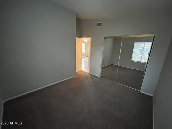 a bathroom with a double vanity sink mirror and toilet