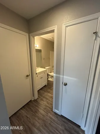 a white toilet sitting next to a bath tub