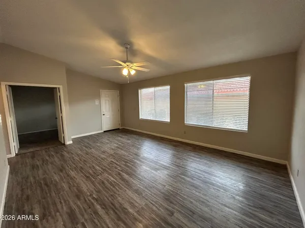 a view of a kitchen from a hallway
