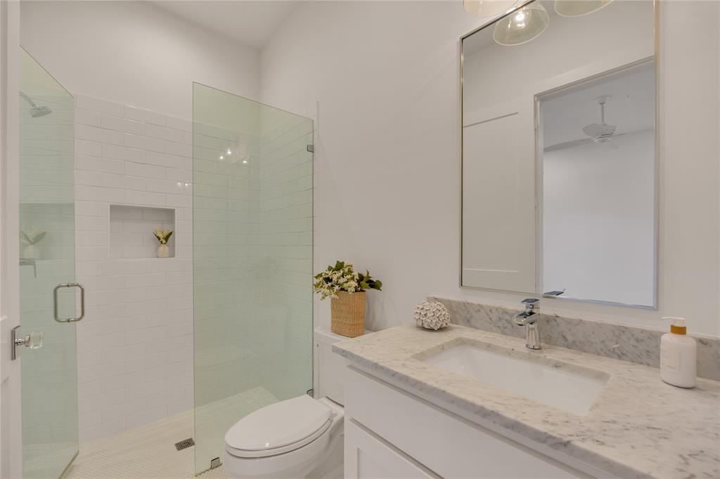 5552 Longview Street Dallas, TX 75206 - Photo 36 of 36 Downstairs full/private bath serves the downstairs bedroom.