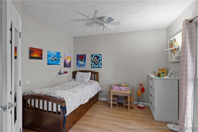 a bedroom with a bed and a table in it