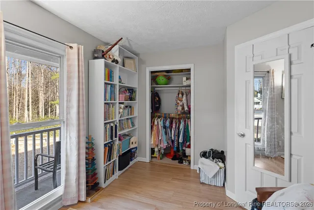 a view of a livingroom with furniture and staircase