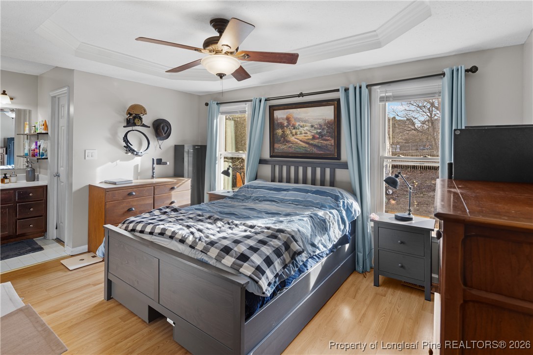 226 Overton Road Raeford, NC 28376 - Photo 19 of 24 a bedroom with a bed and a flat tv screen on dresser