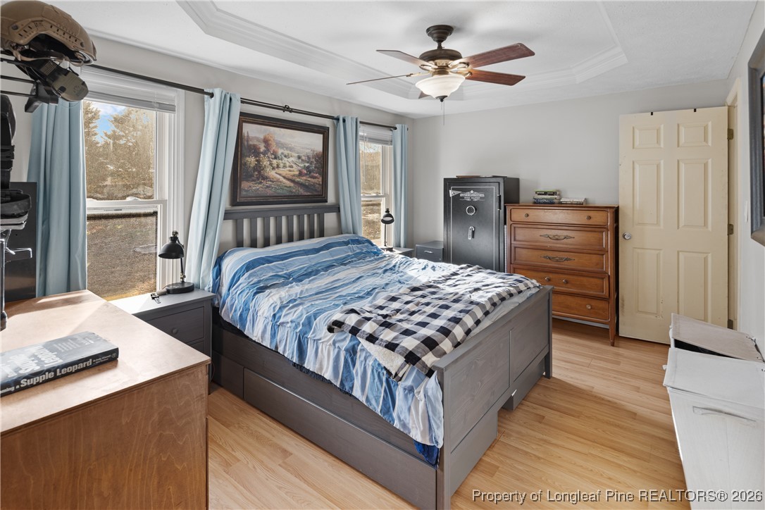 226 Overton Road Raeford, NC 28376 - Photo 20 of 24 a bedroom with a bed a dresser next to a window