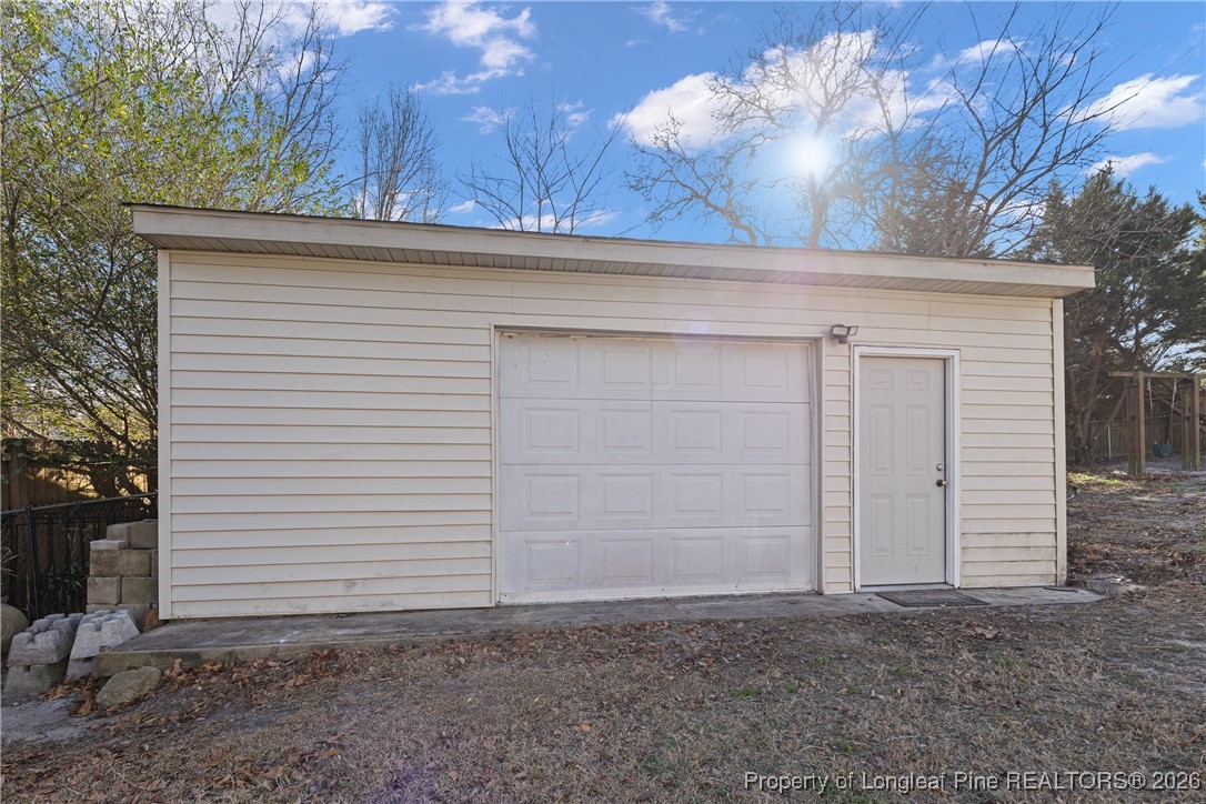 226 Overton Road Raeford, NC 28376 - Photo 23 of 24 a view of a house with a garage