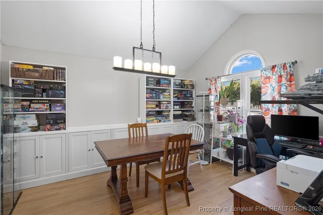 a view of a dining room with furniture window and wooden floor