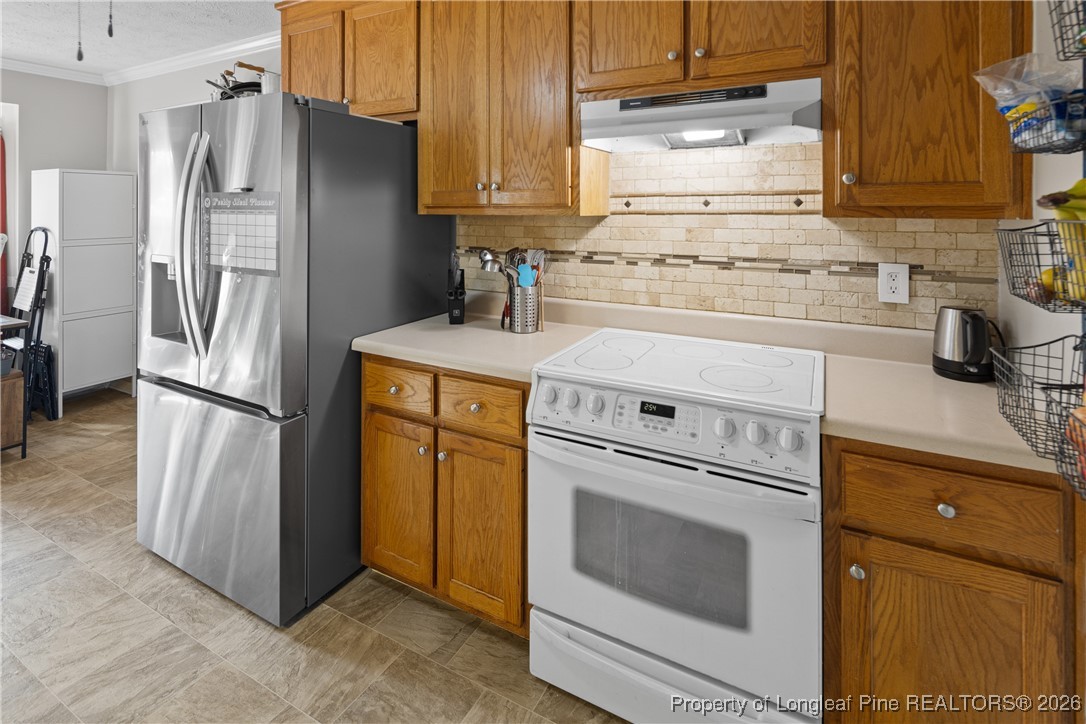 226 Overton Road Raeford, NC 28376 - Photo 6 of 24 a kitchen with a stove top oven sink and refrigerator