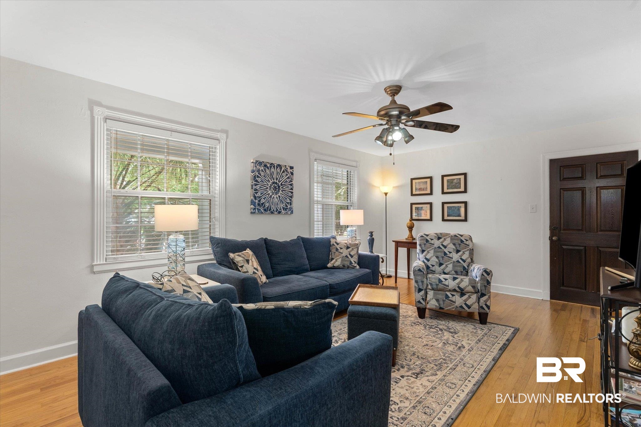 214 Upham Street, Unit 18A Mobile, AL 36607 - Photo 5 of 29 Living area featuring light wood finished floors and a ceiling fan