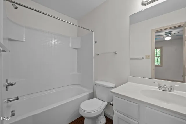 a bathroom with a sink a toilet and a bathtub