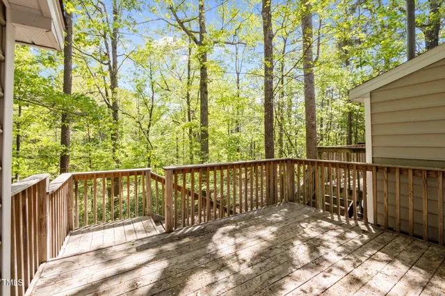 a view of a balcony with yard