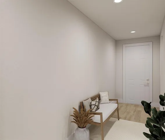 a bedroom with furniture and a window