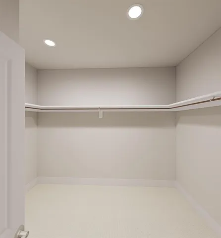 a bathroom with a bathtub shower sink vanity mirror and toilet