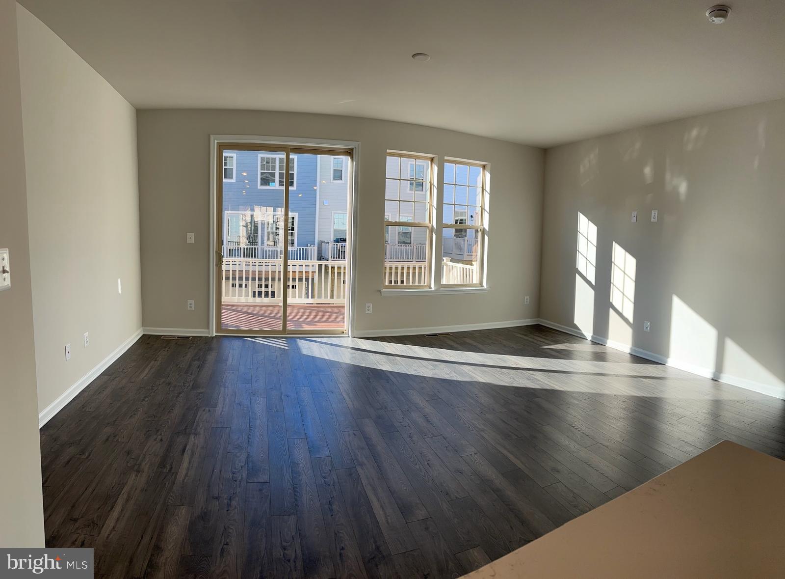 9361 Barnes Loop Manassas, VA 20110 - Photo 5 of 22 a view of empty room with wooden floor and fan