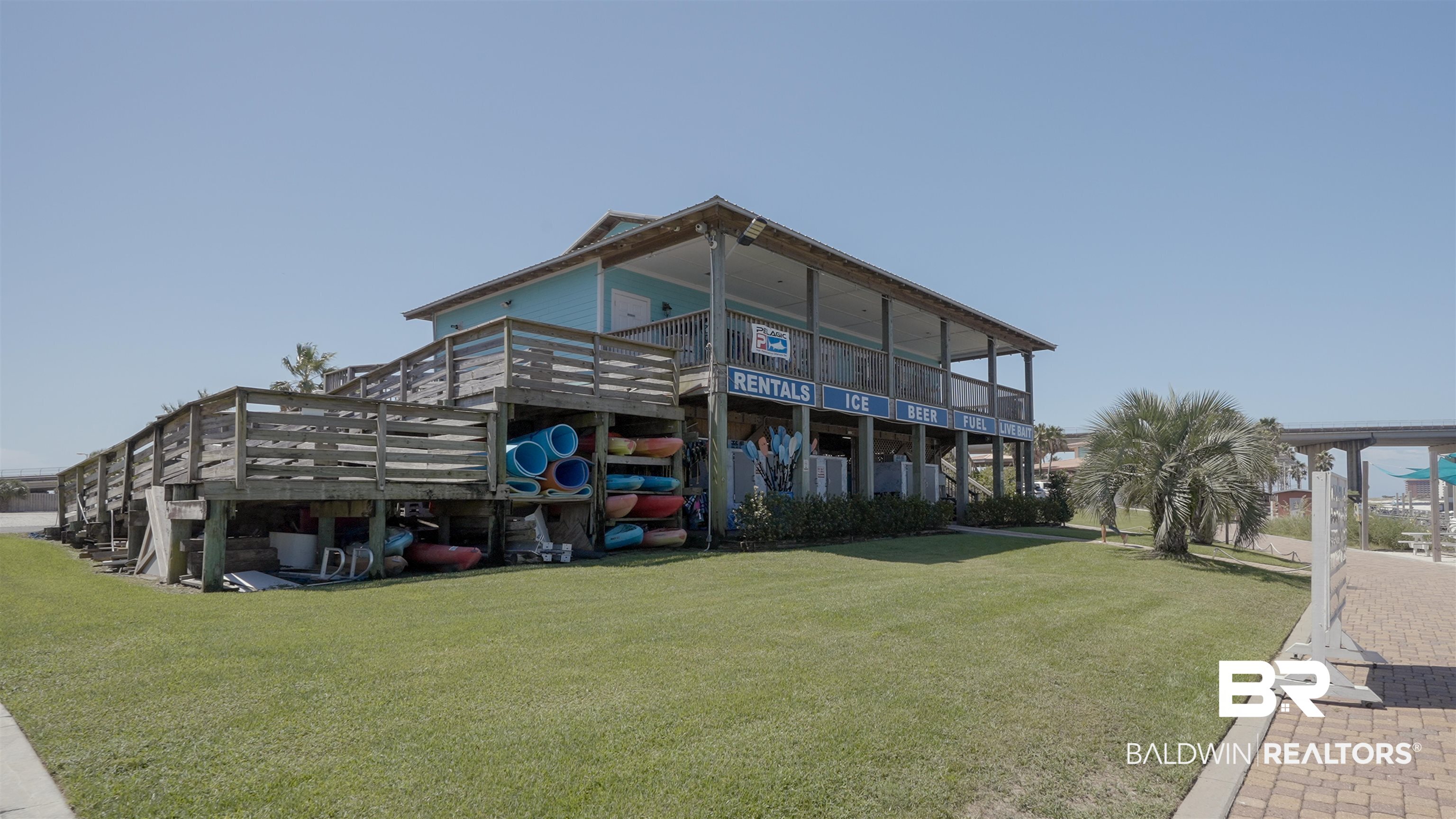 28107 Perdido Beach Boulevard, Unit DPH06 Orange Beach, AL 36561 - Photo 70 of 70 Rear view of house with a deck and a yard