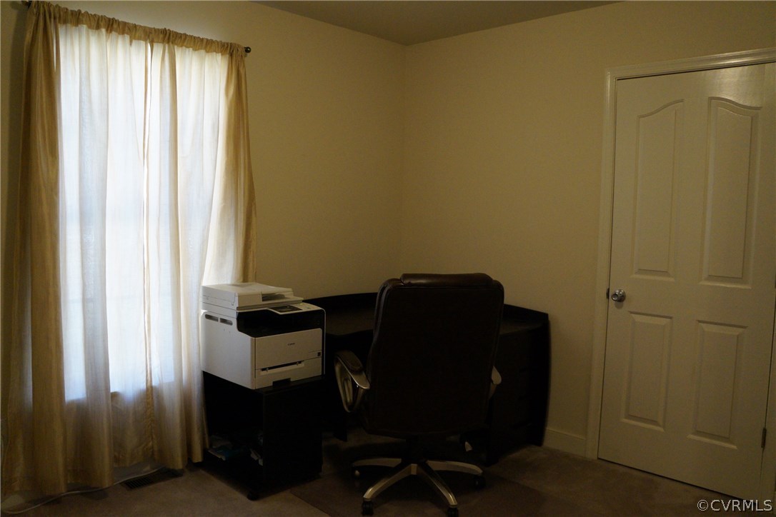 969 Mill Creek Road Meherrin, VA 23954 - Photo 16 of 27 a view of a workspace with furniture and a window