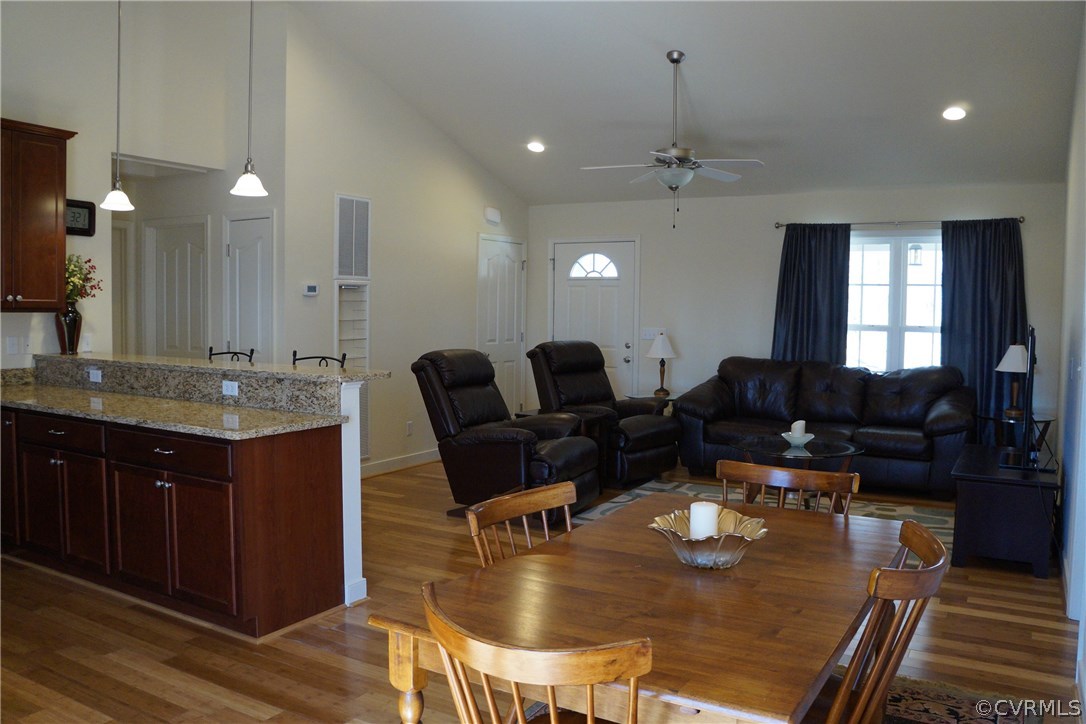 969 Mill Creek Road Meherrin, VA 23954 - Photo 9 of 27 a living room with dining table furniture and a chandelier