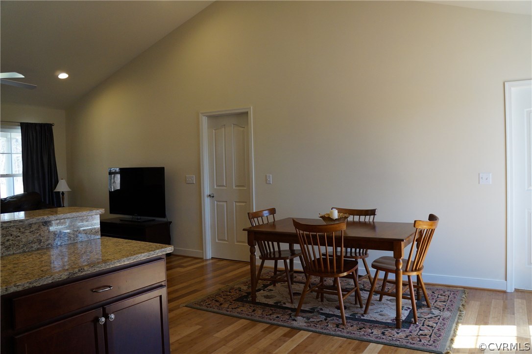 969 Mill Creek Road Meherrin, VA 23954 - Photo 10 of 27 a view of a dining room with furniture and wooden floor