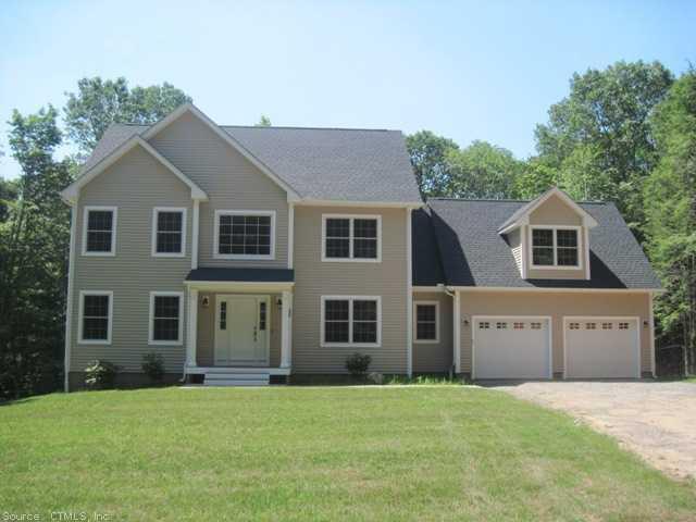 62 Trowbridge Road Coventry, CT 06238 - Photo 1 of 1 a front view of a house with a yard and garage