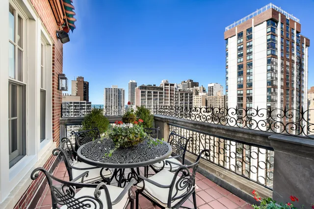 a view of a tall building from a balcony