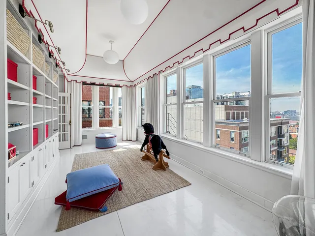 a bed room with a bed and a chandelier