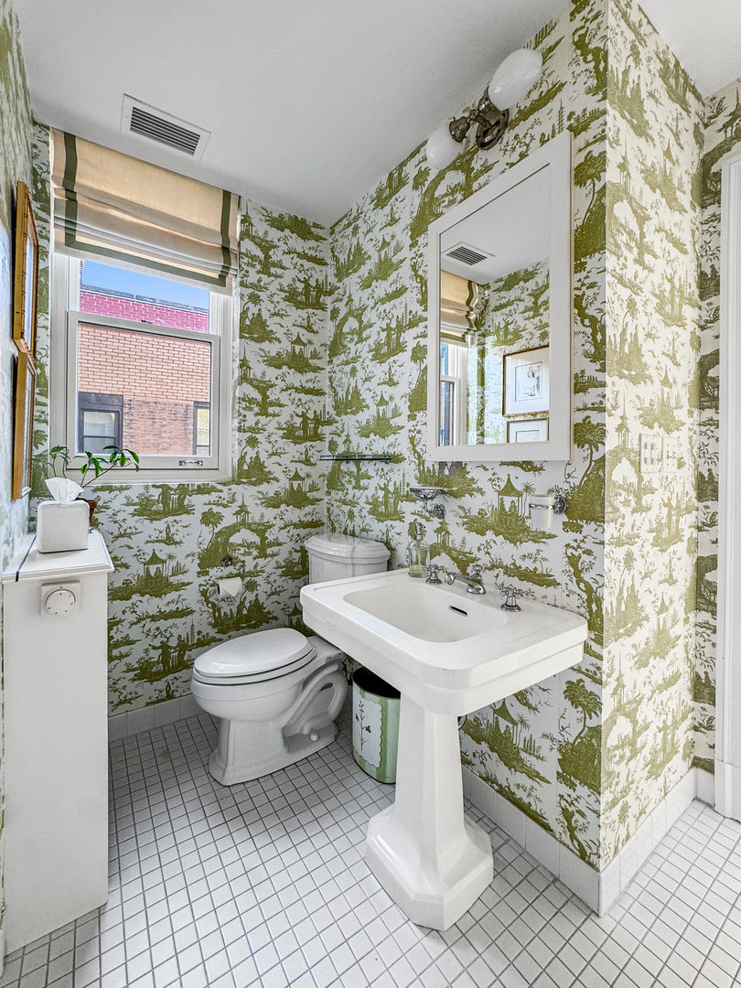 1320 North State Parkway, Unit 1415CD Chicago, IL 60610 - Photo 41 of 51 a bathroom with a sink toilet and mirror