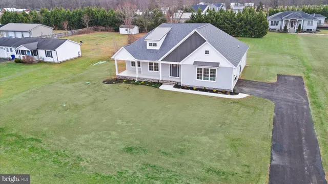 a aerial view of a house with a big yard
