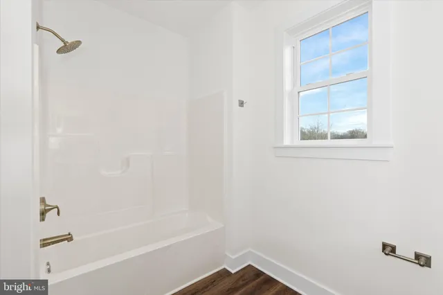 a room with a sink and cabinets