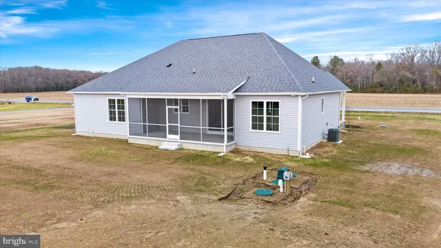 a view of a house with pool and sitting area