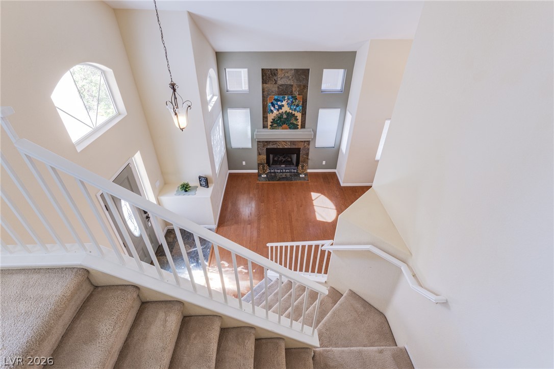 253 Camelback Ridge Avenue Henderson, NV 89012 - Photo 17 of 26 Soaring ceilings and warm hardwood floors define this inviting split-level living area.