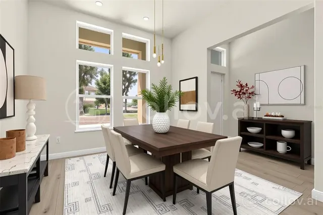 a view of a dining room with furniture and window