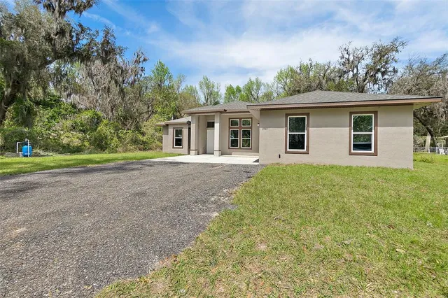 front view of a house with a yard