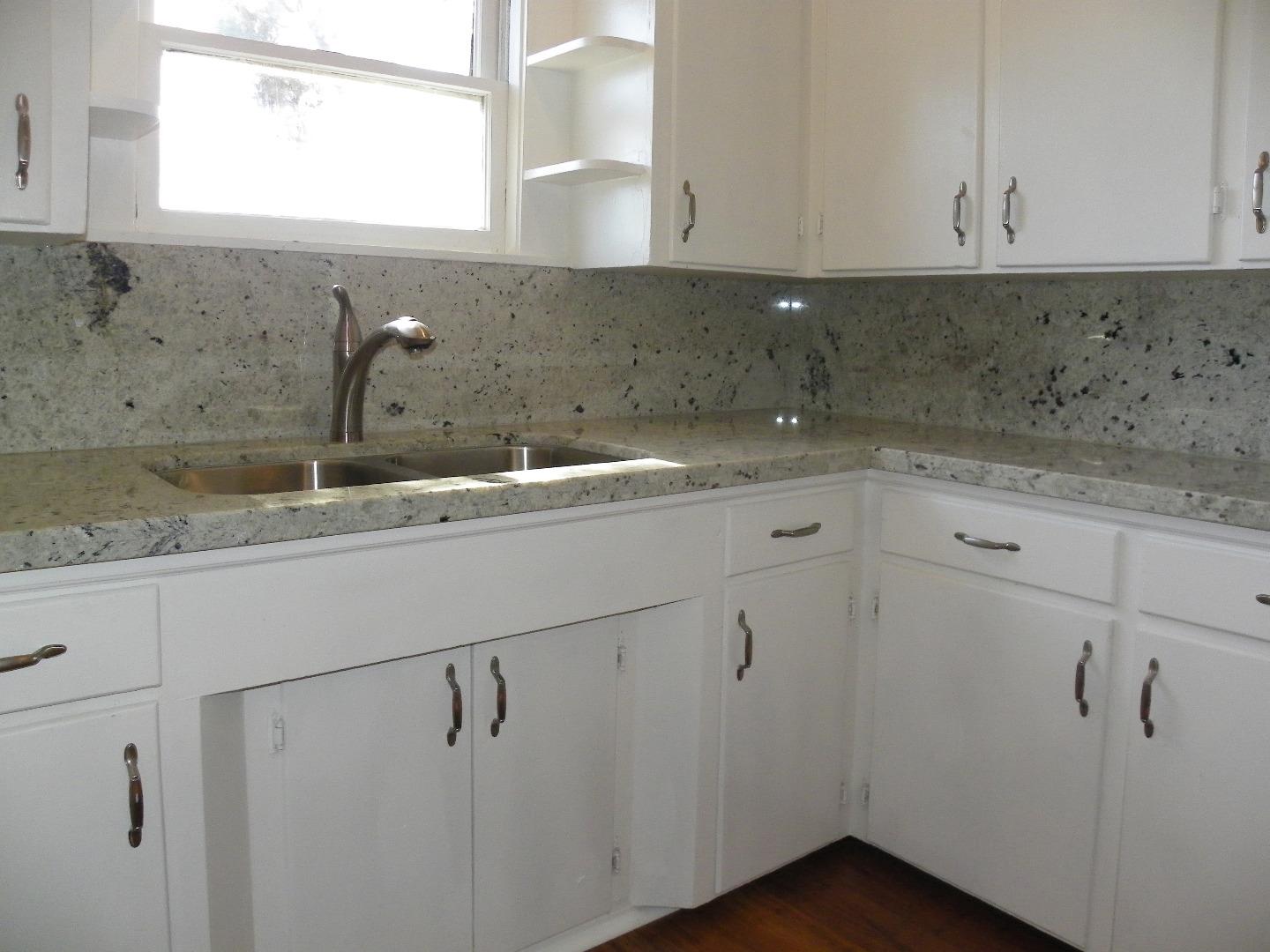 254 Hames Road Corralitos, CA 95076 - Photo 7 of 19 a kitchen with a sink and cabinets