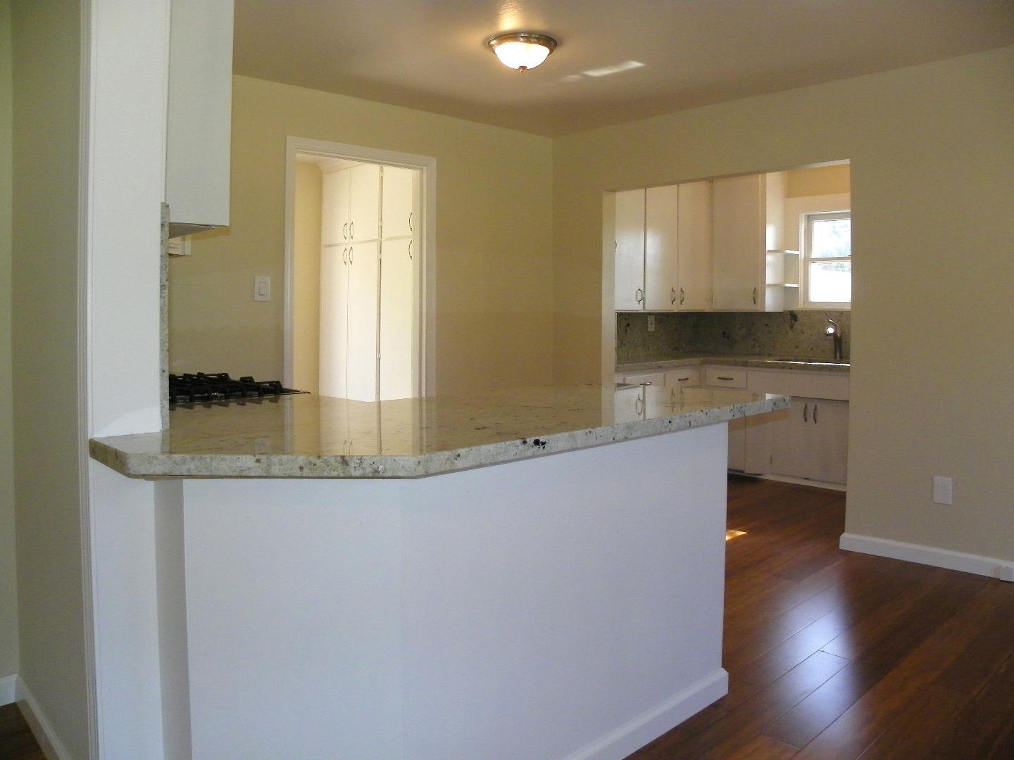 254 Hames Road Corralitos, CA 95076 - Photo 8 of 19 a large bathroom with a granite countertop sink and a large mirror