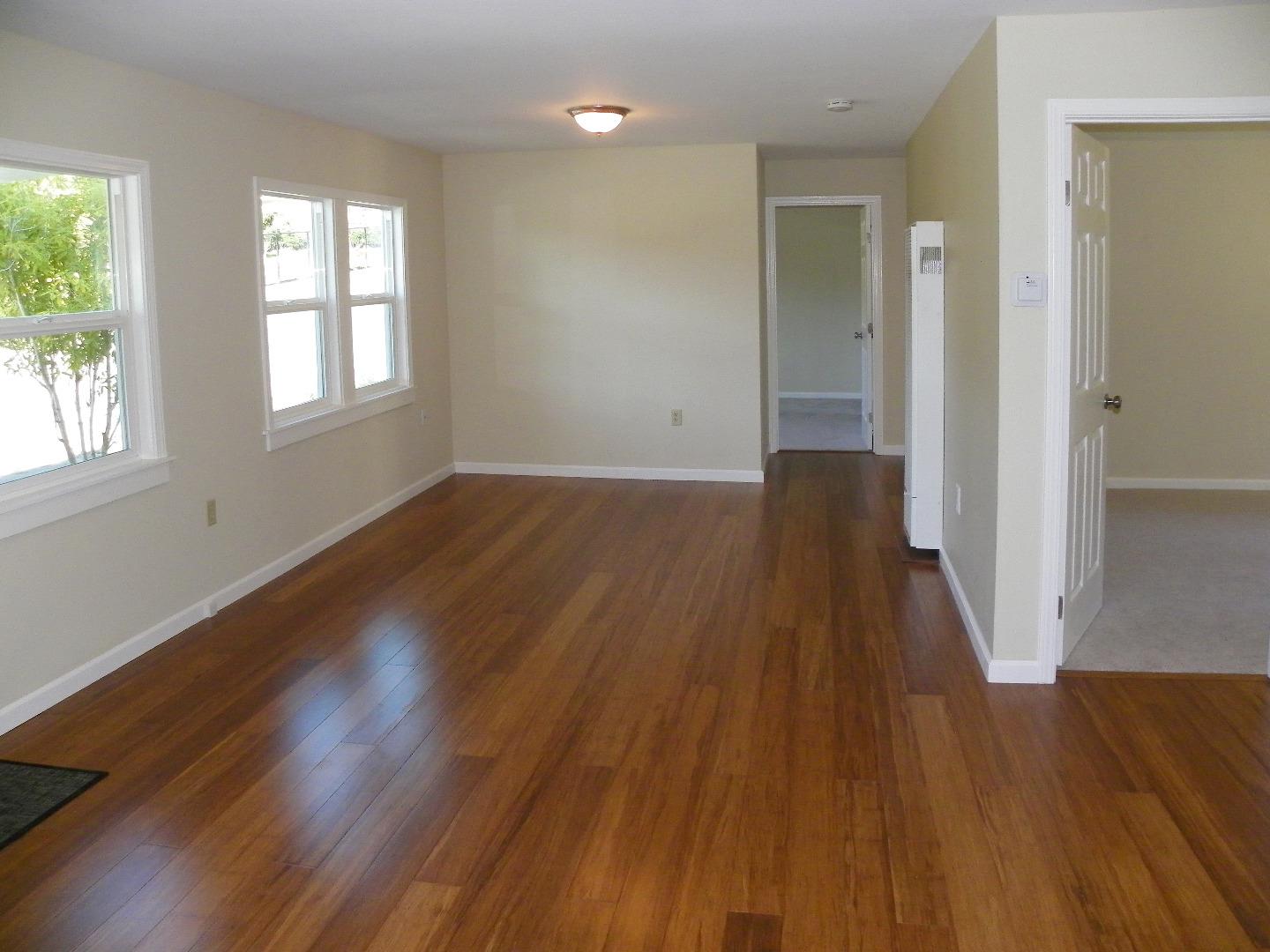 254 Hames Road Corralitos, CA 95076 - Photo 10 of 19 an empty room with wooden floor and windows