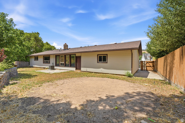 1410 Sumac Drive Logan, UT 84321 - Photo 25 of 28 Ranch-style exterior with beige horizontal siding and a brown shingle roof