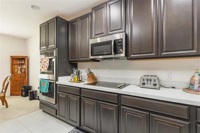 a kitchen with stainless steel appliances and cabinets