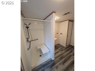 77940 Highway 99, Unit 19 Cottage Grove, OR 97424 - Photo 3 of 5 a bathroom with a shower and a mirror