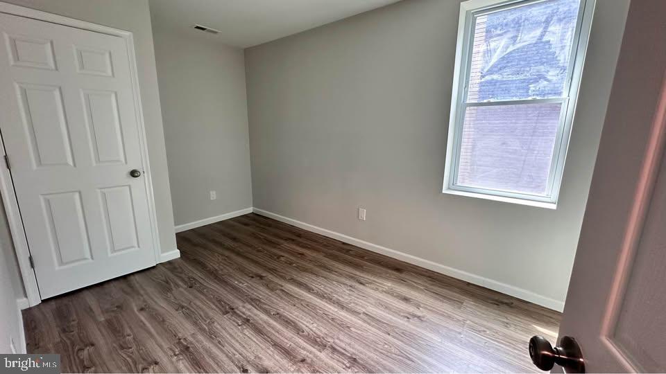 2808 Pomeroy Road Southeast, Unit 1 Washington, DC 20020 - Photo 2 of 7 a view of an empty room and wooden floor