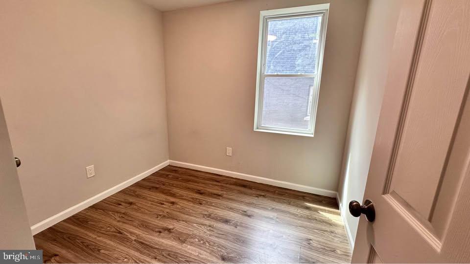 2808 Pomeroy Road Southeast, Unit 1 Washington, DC 20020 - Photo 4 of 7 a view of a small space with wooden floor and a window