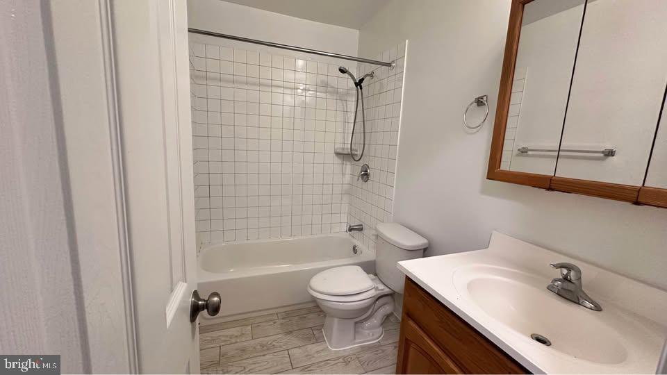 2808 Pomeroy Road Southeast, Unit 1 Washington, DC 20020 - Photo 5 of 7 a bathroom with a bathtub shower sink vanity and toilet