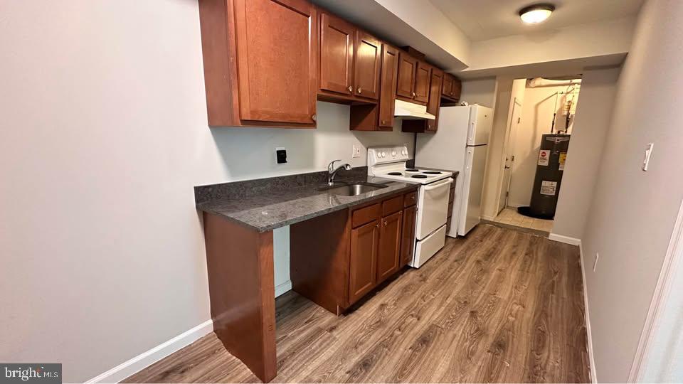 2808 Pomeroy Road Southeast, Unit 1 Washington, DC 20020 - Photo 6 of 7 a kitchen with stainless steel appliances granite countertop a stove a sink and a refrigerator