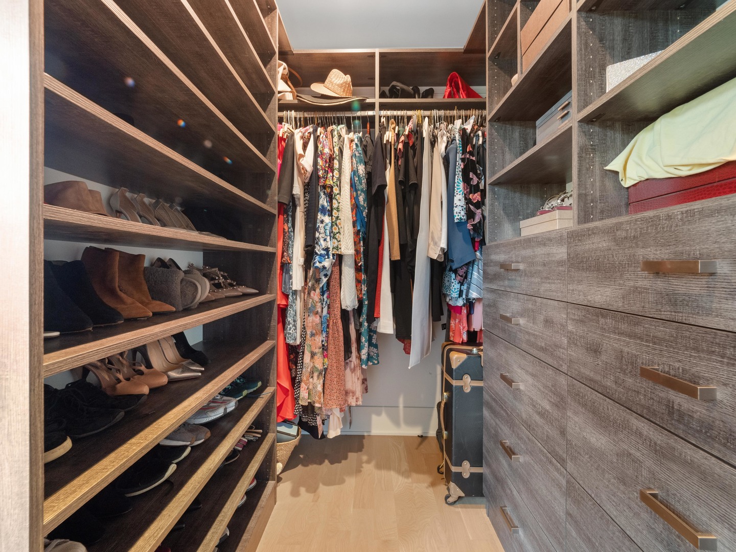 2252 North Orchard Street, Unit 3S Chicago, IL 60614 - Photo 24 of 31 a view of walk in closet with clothes and shoes